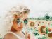 woman standing on sunflower field