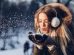 woman blowing snow on her hands