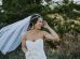 women's white wedding gown near grass