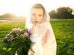 woman wearing pink veil holding pink flower bouquet